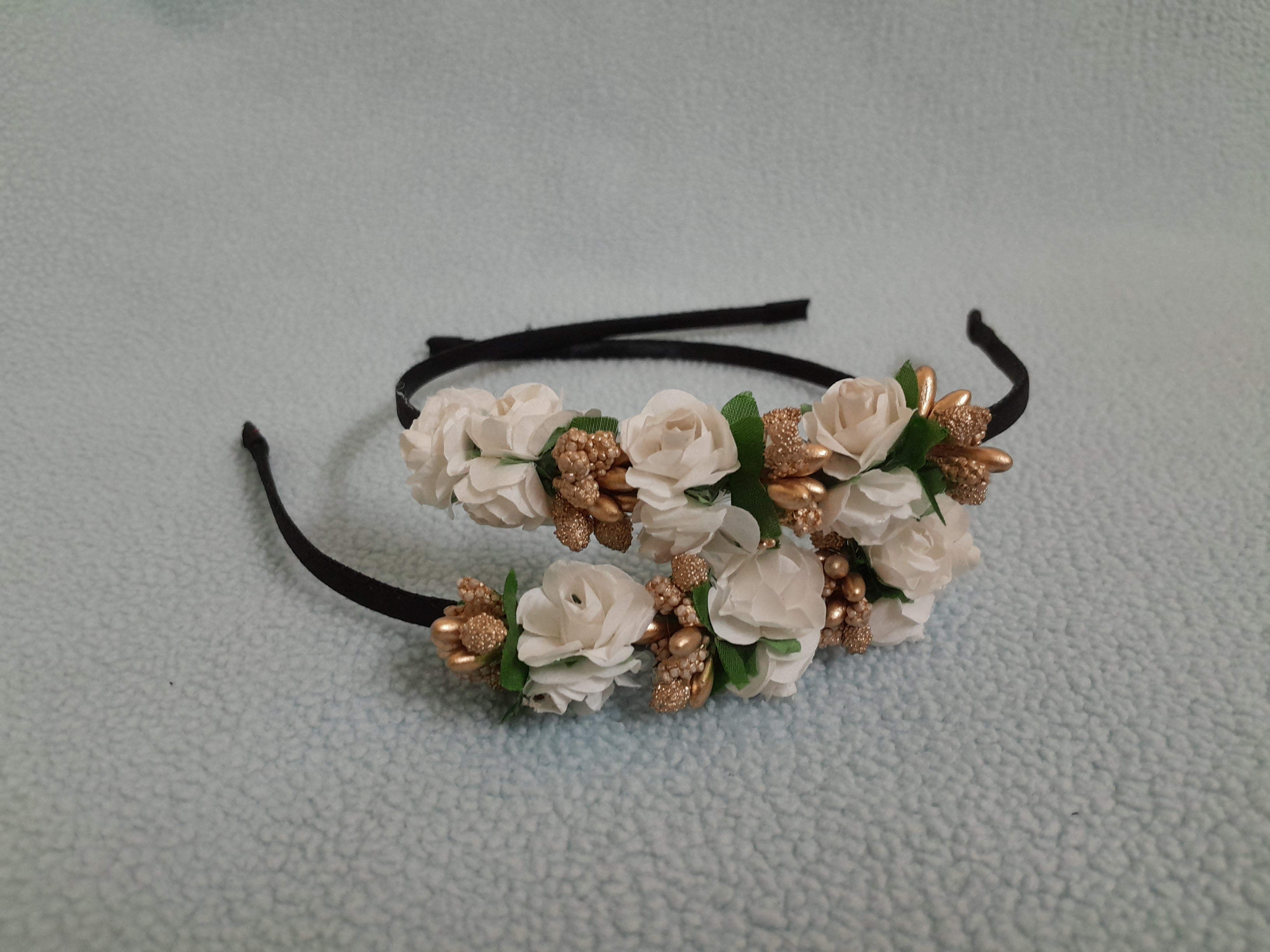 Floral headband with white flowers and gold accents 