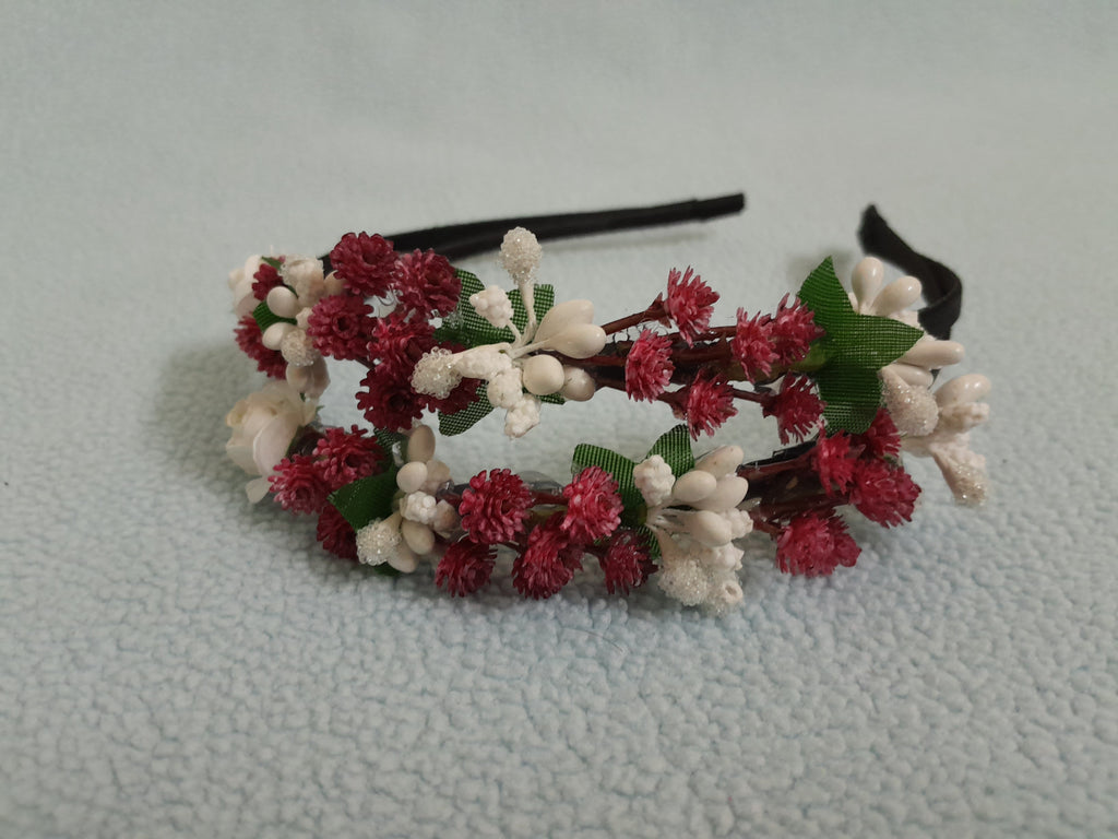 Floral headband with red, white, and green flowers 