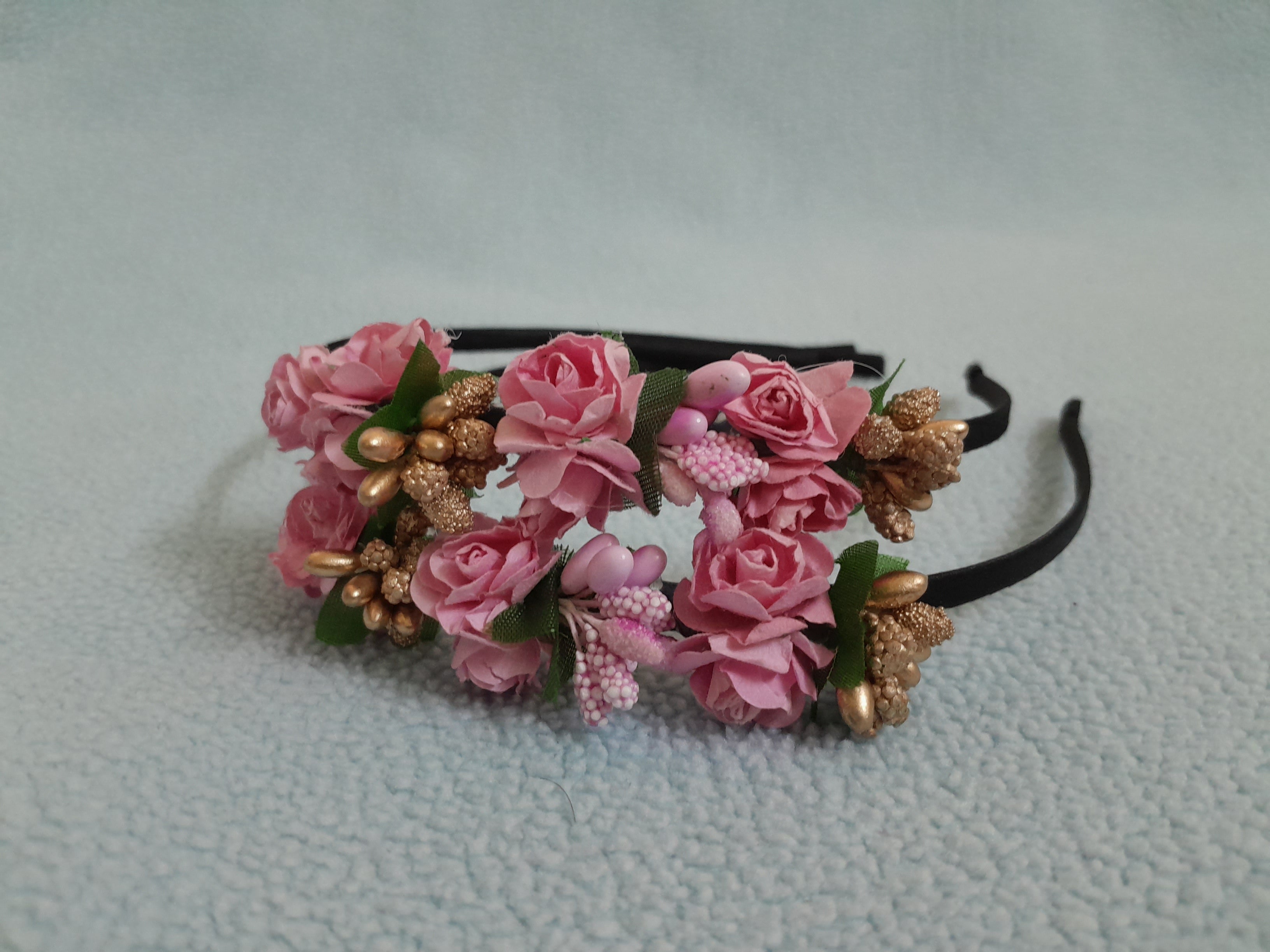 Floral headband with pink flowers and gold accents 