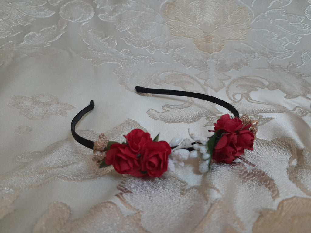 Black headband with red floral decorations 